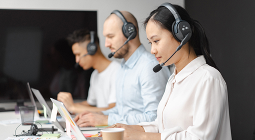 Customer service representative communicating with a client, highlighting DELTA CAINA's commitment to excellent customer support and global collaboration.